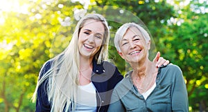 Portrait, senior woman and adult daughter in park, happy outdoor with hug, laughter and spending quality time together