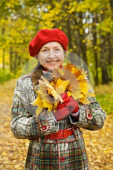 Portrait of senior woman in autumn