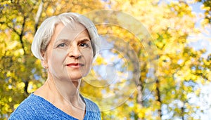 Portrait of senior woman in autumn park