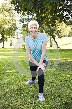 Portrait of senior woman doing streching exercise