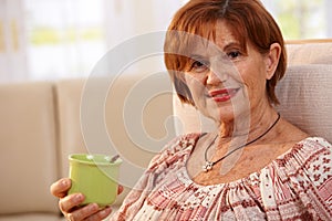 Portrait of senior woman drinking coffee