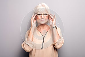 Portrait of senior woman in eyeglasses.