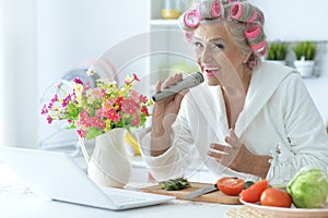 Portrait of senior woman in hair rollers