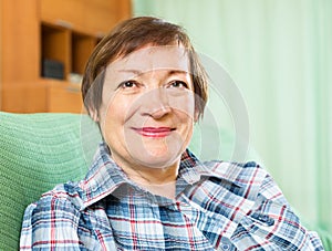 Portrait of senior woman relaxing in couch