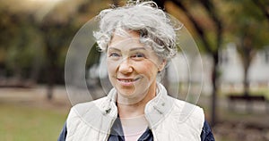Portrait, senior woman and smile in the park with happiness in nature, woods or outdoor for a walk in retirement. Happy