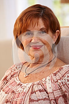 Portrait of senior woman smiling at home