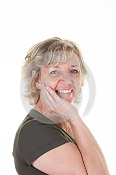 Portrait senior woman smiling looking cute smile posing in white wall background