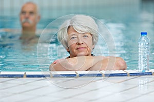 Portrait senior woman in swimming pool