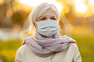 Portrait of senior woman wearing protective face mask