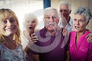 Portrait of seniors doing funny faces