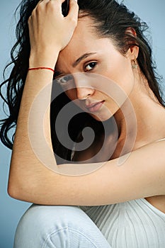 Portrait of a sensual, serious woman with vitiligo eyelashes