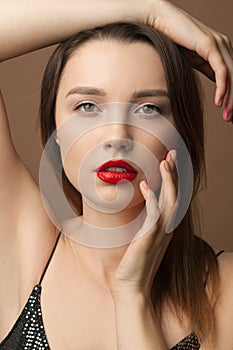 Portrait of a sensual woman. Face close up. Red lipstick