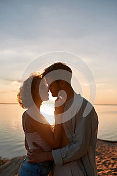 Portrait of sensual young man and woman kissing