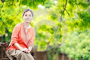 Portrait of serene mature woman in garden