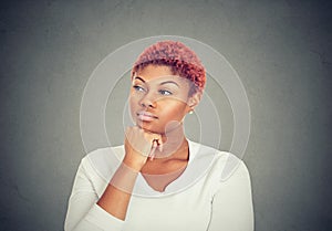 Portrait of a serious beautiful young woman looking away