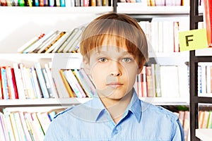 Portrait of serious boy in the library