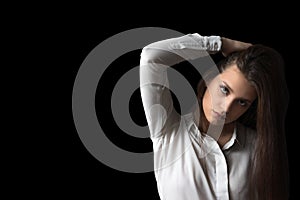 Portrait of serious brunette girl looking at the camera