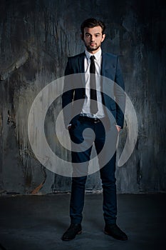 Portrait of a serious businessman in blue suit