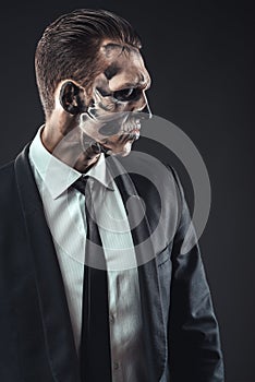 Portrait serious businessman makeup skeleton