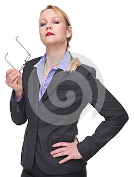 Portrait of a serious businesswoman holding glasses