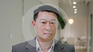 Portrait serious calm Asian ethnic man business employer peaceful Korean businessman Chinese male Japanese middle-aged