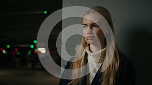 Portrait serious Caucasian 30s woman businesswoman driver car owner posing on darkness background female entrepreneur