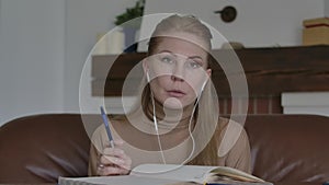 Portrait of serious Caucasian woman disagree with someone. Charming blond lady talking and gesturing in online video