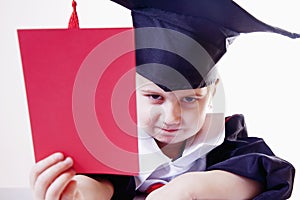 Portrait of serious child girl judge lawyer with red card as s