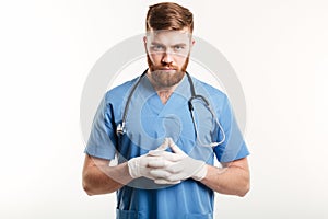 Portrait of a serious concentrated male medical doctor or nurse