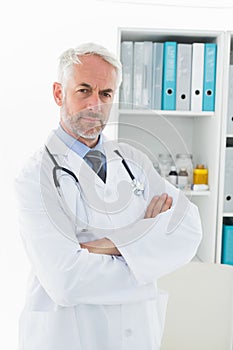 Portrait of a serious confident male doctor at medical office