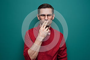 Portrait of a serious doubting man in glasses