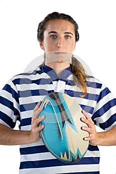 Portrait of serious female player holding rugby ball