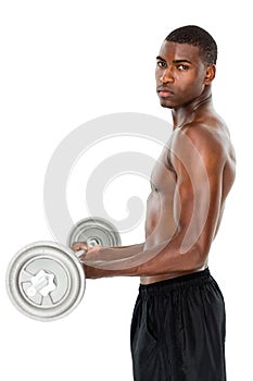 Portrait of a serious fit young man lifting barbell