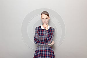 Portrait of serious focused young blond woman