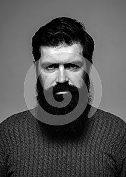 Portrait of serious man with beard and mustache. Hipster thinking. Face expression. Handsome male closeup face.