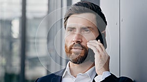 Portrait serious man talking on mobile phone answering business call successful businessman professional manager agent