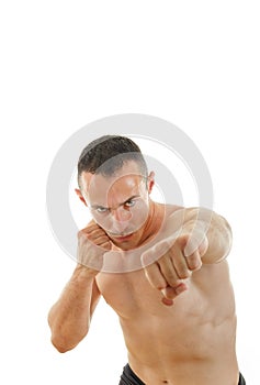 Portrait of serious sportsman boxer fihter in fight position