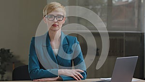 Portrait serious successful professional mature woman with short hair businesswoman female specialist secretary wears