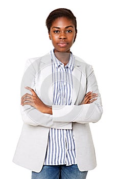 Serious young african american woman standing against isolated white background with arms crossed
