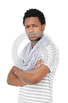 Portrait of a serious young man with arms crossed