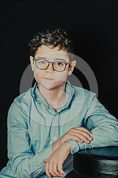 portrait of a serious young man with glasses
