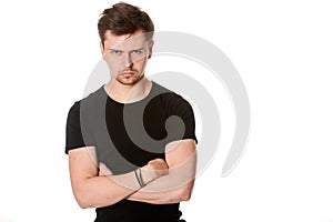 Portrait of serious young man, questioning expression,horizontal on white background with space for text
