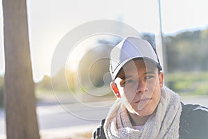 Portrait of a serious young man wearing a cap