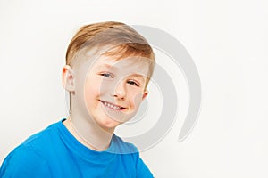 Portrait of seven years old boy in blue t-shirt