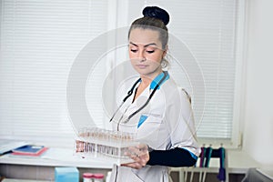 A portrait of beautiful midicine nurse doctor in a white gown