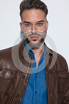 Portrait of a sexy casual man wearing eyeglasses