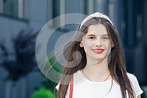 Portrait of sexy smiling caucasian young woman model with glamour red lips,bright makeup. Stylish pretty woman outdoor