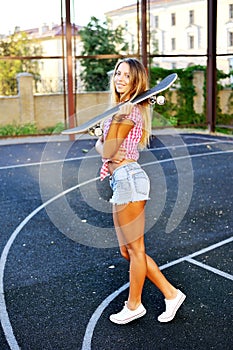 Portrait of young stylish smiling woman girl model in brigh