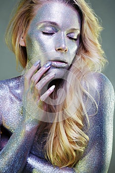 Beautiful Woman with Sparkles on her Face and body