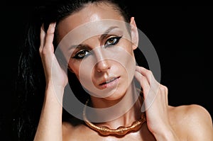 Portrait of shining glamourous woman with wet hair on black back